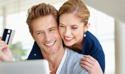 couple at laptop with credit card