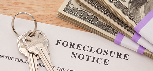 Keys, Stack of Money and Foreclosure Notice